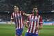 Atletico's Raul Garcia, centre, celebrates his goal with Tiago during a Spanish Copa del Rey soccer match between Atletico de Madrid and Valencia at the Vicente Calderon stadium in Madrid, Spain, Tuesday, Jan. 14, 2014. (AP Photo/Andres Kudacki)