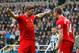 NEWCASTLE-UPON-TYNE, ENGLAND - OCTOBER 19: Steven Gerrard (L) of Liverpool celebrates scoring his 100th Premier League goal and his team's first with team-mate Jordan Henderson during the Barclays Premier League match between Newcastle United and Liverpool at St James' Park on October 19, 2013 in Newcastle-Upon-Tyne, England. (Photo by Paul Thomas/Getty Images)