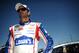Jimmie Johnson stands by his car during qualifying for the NASCAR Sprint Cup Series auto race at Talladega Superspeedway, Saturday, May 3, 2014, in Talladega, Ala. (AP Photo/Rainier Ehrhardt)