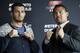 Dutch middleweight fighter Gegard Mousasi, left, and Mark Munoz from the US, right, pose for the photographers prior to a joint press conference in Berlin, Germany, Thursday, April 3, 2014. Munoz and Mousasi will fight during a UFC (Ultimate Fighting Championship) fight night in Berlin on Saturday, May 31, 2014. (AP Photo/Michael Sohn)