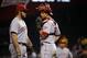 Cincinnati Reds catcher Devin Mesoraco, right, talks with relief pitcher J.J. Hoover (60) during the ninth inning of a baseball game against the Pittsburgh Pirates in Pittsburgh Monday, April 21, 2014. (AP Photo/Gene J. Puskar)