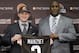 Cleveland Browns quarterback Johnny Manziel, from Texas A&M, holds his new jersey with general manager Ray Farmer at the NFL football team's facility in Berea, Ohio Friday, May 9, 2014. The Browns selected Manziel with the 22nd overall pick in Thursday's NFL draft. (AP Photo/Tony Dejak)