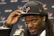 Houston Texans No. 1 overall NFL draft pick Jadeveon Clowney, a defensive end from South Carolina, tips his cap as he meets the press during an introductory NFL football news conference Friday, May 9, 2014, in Houston. (AP Photo/Pat Sullivan)