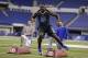 Boise State defensive lineman Demarcus Lawrence runs a drill at the NFL football scouting combine in Indianapolis, Monday, Feb. 24, 2014. (AP Photo/Michael Conroy)