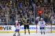 Boston Bruins left wing Milan Lucic (17) celebrates his empty-net goal with fans as Montreal Canadiens center Lars Eller (81) and center Tomas Plekanec (14) skate off during the third period in Game 2 of an NHL hockey second-round playoff series in Boston, Saturday, May 3, 2014. The Bruins won 5-3. (AP Photo/Elise Amendola)