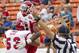 Fresno State offensive linesman Mike Saenz (53) picks up wide receiver Davante Adams (15) after Adams' touchdown reception in the third quarter against SMU in the Hawaii Bowl, an NCAA college football game Monday, Dec. 24, 2012, in Honolulu. (AP Photo/Eugene Tanner)