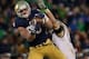 SOUTH BEND, IN - NOVEMBER 02: Troy Niklas #85 of the Notre Dame Fighting Irish catches a first down pass in front of Cody Peterson #53 of the Navy Midshipmen at Notre Dame Stadium on November 2, 2013 in South Bend, Indiana. Notre Dame defeated Navy 38-34. (Photo by Jonathan Daniel/Getty Images)