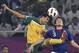 Australia's Tim Cahill, left, and Japan's Daiki Iwamasa in action during the AFC Asian Cup final soccer match in Doha, Qatar, Saturday, Jan. 29, 2011. (AP Photo/Hassan Ammar)
