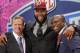 Virginia tackle Morgan Moses poses for photos with NFL commissioner Roger Goodell and former Washington Redskins' linebacker London Fletcher after being selected as the 66th pick during the third round of the 2014 NFL Draft, Friday, May 9, 2014, in New York. (AP Photo/Jason DeCrow)