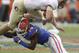 Florida defensive back Jaylen Watkins (14) upends Florida State tight end Nick O'Leary after a reception during the first half of an NCAA college football game in Gainesville, Fla., Saturday, Nov. 30, 2013.(AP Photo/John Raoux)