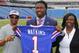 Buffalo Bills first round draft pick Sammy Watkins poses for photos with his father James McMiller, left, and mother Nicole McMiller at Ralph Wilson Stadium in Orchard Park, N.Y., Friday, May 9, 2014. (AP Photo/Bill Wippert)