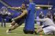 Bloomsburg defensive lineman Larry Webster runs a drill at the NFL football scouting combine in Indianapolis, Monday, Feb. 24, 2014. (AP Photo/Michael Conroy)