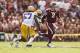 Oct 20, 2012; College Station, TX, USA; Texas A&M Aggies quarterback Johnny Manziel (2) scrambles from LSU Tigers linebacker Lamin Barrow (57) and cornerback Jalen Mills (28) during the first half at Kyle Field. Mandatory Credit: Thomas Campbell
