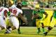 EUGENE, OR - SEPTEMBER 1: Kenjon Barner #24 of the Oregon Ducks rushes past Ryan Carrethers #98 of the Arkansas State Red Wolves in the second quarter on September 1, 2012 at Autzen Stadium in Eugene, Oregon. (Photo by Craig Mitchelldyer/Getty Images)