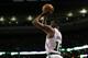 Boston Celtics forward Chris Johnson (12) shoots during the second quarter of an NBA basketball game Friday, April 4, 2014, in Boston. (AP Photo/Charles Krupa)