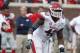 Arkansas defensive end Chris Smith (42) sets up for play against Mississippi during the second half of their NCAA college football game at Vaught-Hemingway Stadium in Oxford, Miss., on Saturday, Nov. 9, 2013. Mississippi won 34-24. (AP Photo/Rogelio V. Solis)