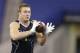 UCLA linebacker Jordan Zumwalt runs a drill at the NFL football scouting combine in Indianapolis, Monday, Feb. 24, 2014. (AP Photo/Michael Conroy)