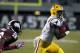 LSU running back Alfred Blue (4) runs past Mississippi State defensive back Kendrick Market (26) for a 17-yard touchdown run in the second half of their NCAA college football game in Starkville, Miss., Saturday, Oct. 5, 2013. No. 10 LSU won 59-26. (AP Photo/Rogelio V. Solis)