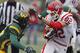Saginaw Valley wide receiver Jeff Janis (82) is pursued by Wayne State safety David Churchwell during the fourth quarter of their Division II NCAA football game Saturday, Oct. 19, 2013, in Detroit. Janis scored two touchdowns in Saginaw Valley's 14-10 win over Wayne State. (AP Photo/Duane Burleson)