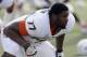 Miami's Seantrel Henderson (77) stretches during pre-game warmups prior to an NCAA college football game against Duke in Durham, N.C., Saturday, Nov. 16, 2013. (AP Photo/Gerry Broome)