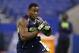 Arizona running back Ka'Deem Carey runs a drill at the NFL football scouting combine in Indianapolis, Sunday, Feb. 23, 2014. (AP Photo/Michael Conroy)