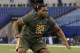 Tennessee offensive lineman Antonio Richardson runs a drill at the NFL football scouting combine in Indianapolis, Saturday, Feb. 22, 2014. (AP Photo/Michael Conroy)