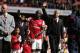 Arsenal's manager Arsene Wenger, center right, and Bacary Sagna, center left, wave to the supporters as the team parade around the stadium in their last home match of the season, after their English Premier League soccer match against West Bromwich Albion at Emirates Stadium in London, Sunday, May 4, 2014. (AP Photo/Sang Tan)