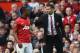 MANCHESTER, ENGLAND - APRIL 26: Ryan Giggs of Manchester United speaks with Patrice Evra during the Barclays Premier League match between Manchester United and Norwich City at Old Trafford on April 26, 2014 in Manchester, England. (Photo by Laurence Griffiths/Getty Images)