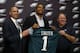 Newly-drafted Philadelphia Eagles' Marcus Smith, center, poses with team president Don Smolenski, left, and head coach Chip Kelly before an NFL football news conference at the team's practice facility, Friday, May 9, 2014, in Philadelphia. Smith was selected in the first round, 26th overall, by the Philadelphia Eagles in the NFL draft on Thursday, May 8, 2014. (AP Photo/Matt Slocum)