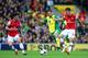 NORWICH, ENGLAND - MAY 11: Mikel Arteta of Arsenal and Aaron Ramsey of Arsenal close down Bradley Johnson of Norwich City during the Barclays Premier League match between Norwich City and Arsenal at Carrow Road on May 11, 2014 in Norwich, England. (Photo by Jamie McDonald/Getty Images)