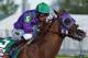 FILE - In this May 3, 2014, file photo, jockey Victor Espinoza rides California Chrome to win the 140th running of the Kentucky Derby horse race at Churchill Downs in Louisville, Ky. The California colt will be running in the Preakness with a bulls-eye on his back as perhaps racing's next superstar. He figures to face eight or nine rivals in the middle leg of the Triple Crown series, and one of them might be a filly. (AP Photo/Matt Slocum, File)
