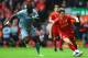 LIVERPOOL, ENGLAND - MAY 11: Joe Allen of Liverpool takes on Moussa Sissoko of Newcastle United during the Barclays Premier League match between Liverpool and Newcastle United at Anfield on May 11, 2014 in Liverpool, England. (Photo by Laurence Griffiths/Getty Images)