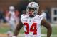 Ohio State running back Carlos Hyde (34) warms-up before an NCAA college football game against Illinois on Saturday, Nov. 16, 2013, in Champaign, Ill. (AP Photo/Jeff Haynes)