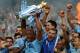 Manchester City's players captain Vincent Kompany, center, holds the Cup and celebrates with teammates after being crowned Premier League Champions, after the English Premier League soccer match between Manchester City and West Ham United at the Etihad Stadium, Manchester, England, Sunday, May 11, 2014. (AP Photo/Rui Vieira)