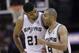 San Antonio Spurs' Tim Duncan (21) and Tony Parker (9) walk of the court during the second half of Game 7 of the opening-round NBA basketball playoff series against the Dallas Mavericks, Sunday, May 4, 2014, in San Antonio. San Antonio won 119-96. (AP Photo/Eric Gay)