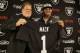 Oakland Raiders first-round draft choice Khalil Mack, right, poses with general manager Reggie McKenzie, left, following a news conference at the team's NFL football headquarters on Friday, May 9, 2014, in Alameda, Calif. Mack, a linebacker, played for Buffalo last season. (AP Photo/Eric Risberg)