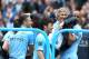 Manchester City's manager Manuel Pellegrini is carried by his players after the English Premier League soccer match between Manchester City and West Ham at the Etihad Stadium in Manchester, England, Sunday May 11, 2014. Manchester City won the Premier League for the second time in three seasons on Sunday, completing its campaign with a comfortable 2-0 victory over West Ham that lacked any of the drama of its previous title. (AP Photo/Jon Super)