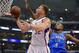 Los Angeles Clippers forward Blake Griffin, left, goes up for a shot as Oklahoma City Thunder forward Serge Ibaka, of Congo, defends in the first half of Game 3 of the Western Conference semifinal NBA basketball playoff series, Friday, May 9, 2014, in Los Angeles. (AP Photo/Mark J. Terrill)