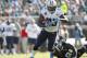 Dec 22, 2013; Jacksonville, FL, USA; Tennessee Titans running back Shonn Greene (23) runs past Jacksonville Jaguars defensive end Andre Branch (90) during the first half at EverBank Field. Mandatory Credit: Kim Klement-USA TODAY Sports