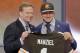 Texas A&M quarterback Johnny Manziel poses with NFL commissioner Roger Goodell after being selected by the Cleveland Browns as the 22nd pick in the first round of the 2014 NFL Draft, Thursday, May 8, 2014, in New York. (AP Photo/Frank Franklin II)