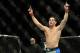 Dec 28, 2013; Las Vegas, NV, USA; Chris Weidman reacts in the cage after defeating Anderson Silva (not pictured) in their UFC middleweight championship bout at the MGM Grand Garden Arena. Mandatory Credit: Jayne Kamin-Oncea-USA TODAY Sports