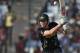 Australia's batsman James Faulkner plays a shot during their ICC Twenty20 Cricket World Cup match against West Indies' in Dhaka, Bangladesh, Friday, March 28, 2014. (AP Photo/Aijaz Rahi)