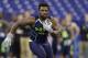 Towson running back Terrance West runs a drill at the NFL football scouting combine in Indianapolis, Sunday, Feb. 23, 2014. (AP Photo/Michael Conroy)
