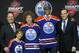Darnell Nurse, second from right, a defenseman, stands with officials from the Edmonton Oilers sweater after being chosen seventh overall in the first round of the NHL hockey draft, Sunday, June 30, 2013, in Newark, N.J. (AP Photo/Bill Kostroun)
