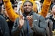 FILE - In this Feb. 15, 2014, file photo, Missouri's All-American defensive end Michael Sam claps during the Cotton Bowl trophy presentation at halftime of an NCAA college basketball game between Missouri and Tennessee in Columbia, Mo. Sam was selected in the seventh round, 249th overall, by the St. Louis Rams in the NFL draft Saturday, May 10, 2014. The Southeastern Conference defensive player of the year last season for Missouri came out as gay in media interviews this year. (AP Photo/L.G. Patterson, File)