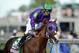 May 3, 2014; Louisville, KY, USA; Victor Espinoza aboard California Chrome (5) after winning the 2014 Kentucky Derby at Churchill Downs. Mandatory Credit: Jamie Rhodes-USA TODAY Sports
