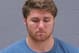 In this May 11, 2014 booking photo provided by Blue Earth County Jail, Philip Nelson, 20, is seen. The former Minnesota Gophers quarterback was arrested in Mankato, Minn., early Sunday, May 11, 2014, on suspicion of third-degree assault. Former Minnesota State, Mankato, linebacker Isaac Dallas Kolstad was in critical condition Monday after an alleged assault involving Nelson. (AP Photo/Blue Earth County Jail)