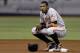 Baltimore Orioles' Adam Jones crouches on second base as Tampa Bay Rays manager Joe Maddon talks to an umpire during the fourth inning of a baseball game Tuesday, May 6, 2014, in St. Petersburg, Fla. (AP Photo/Chris O'Meara)