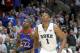Duke forward Jabari Parker and Kansas guard Andrew Wiggins look for a possible rebound off a free-throw attempt during the second half of an NCAA college basketball game Tuesday, Nov. 12, 2013, in Chicago. Kansas won 94-83. (AP Photo/Charles Rex Arbogast)