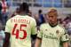 AC Milan's Keisuke Honda, right, of Japan, looks at his teammate Mario Balotelli prior to the start of a Serie A soccer match between Atalanta and AC Milan, in Bergamo, Italy, Sunday, May 11, 2014. (AP Photo/Felice Calabro')
